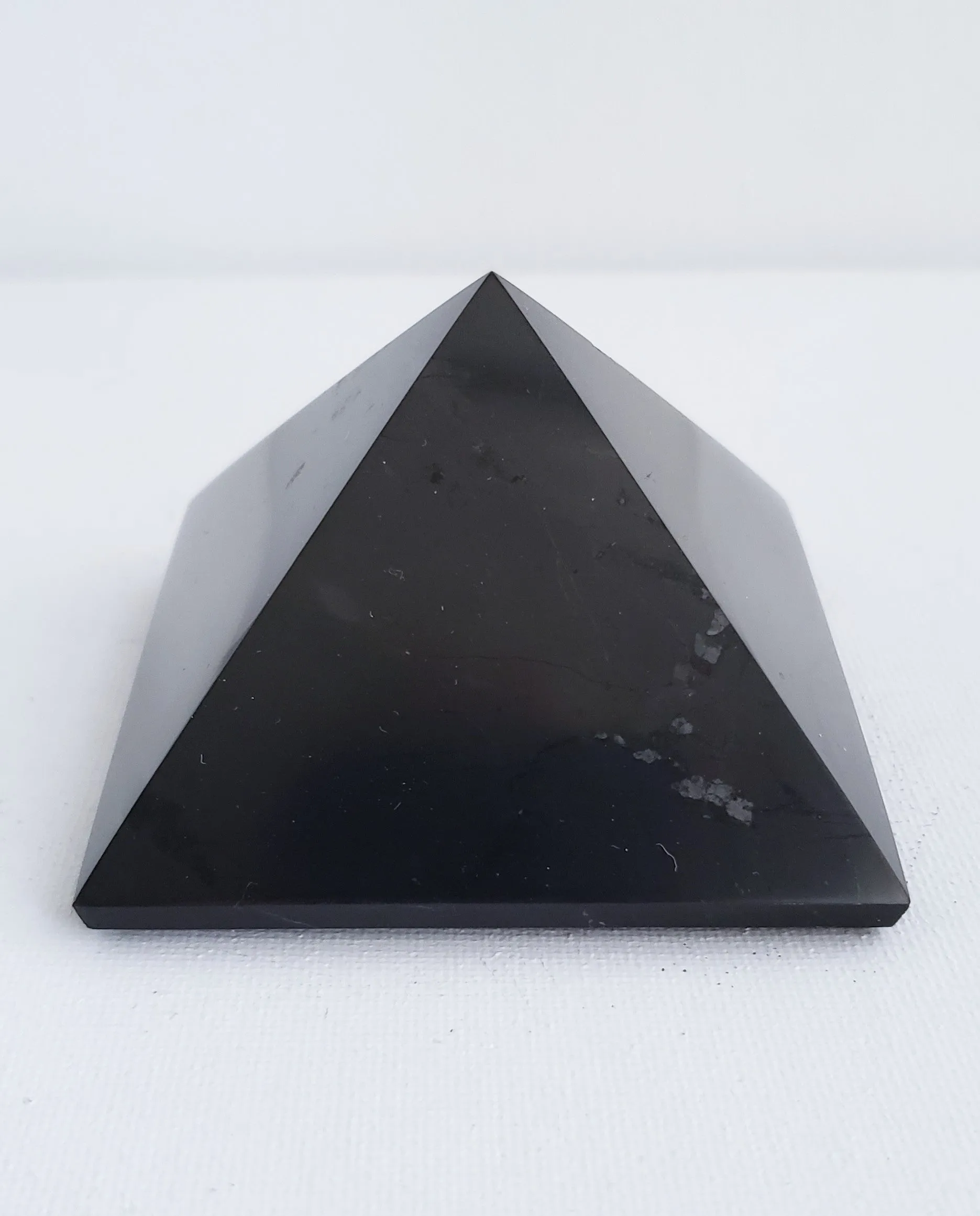 Shungite Medium Size Pyramid Harmonizes Energy Within the Home or Office Space.